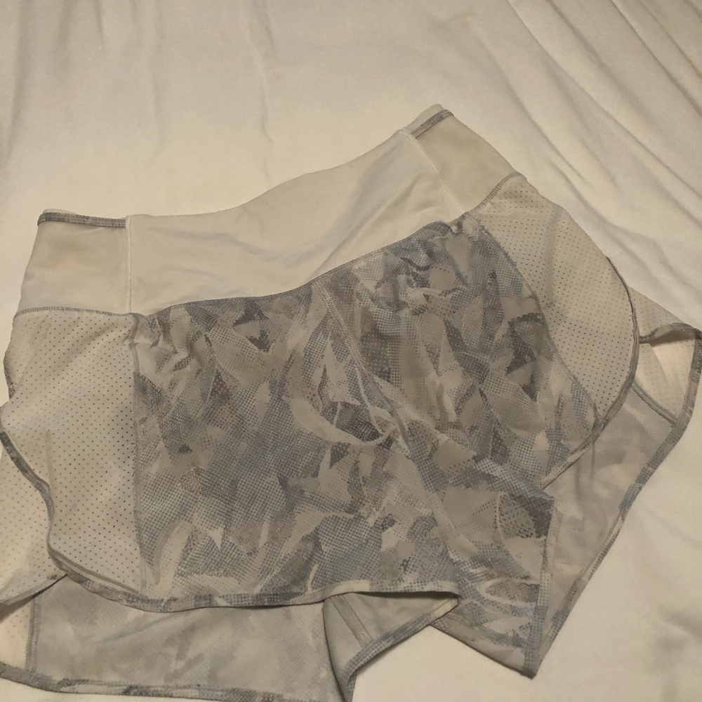 Running shorts with zipper in back